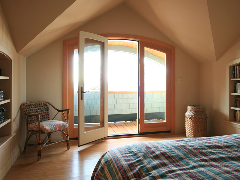 architect designed cottage addition - lake huron - bedroom doors to lakeside balcony